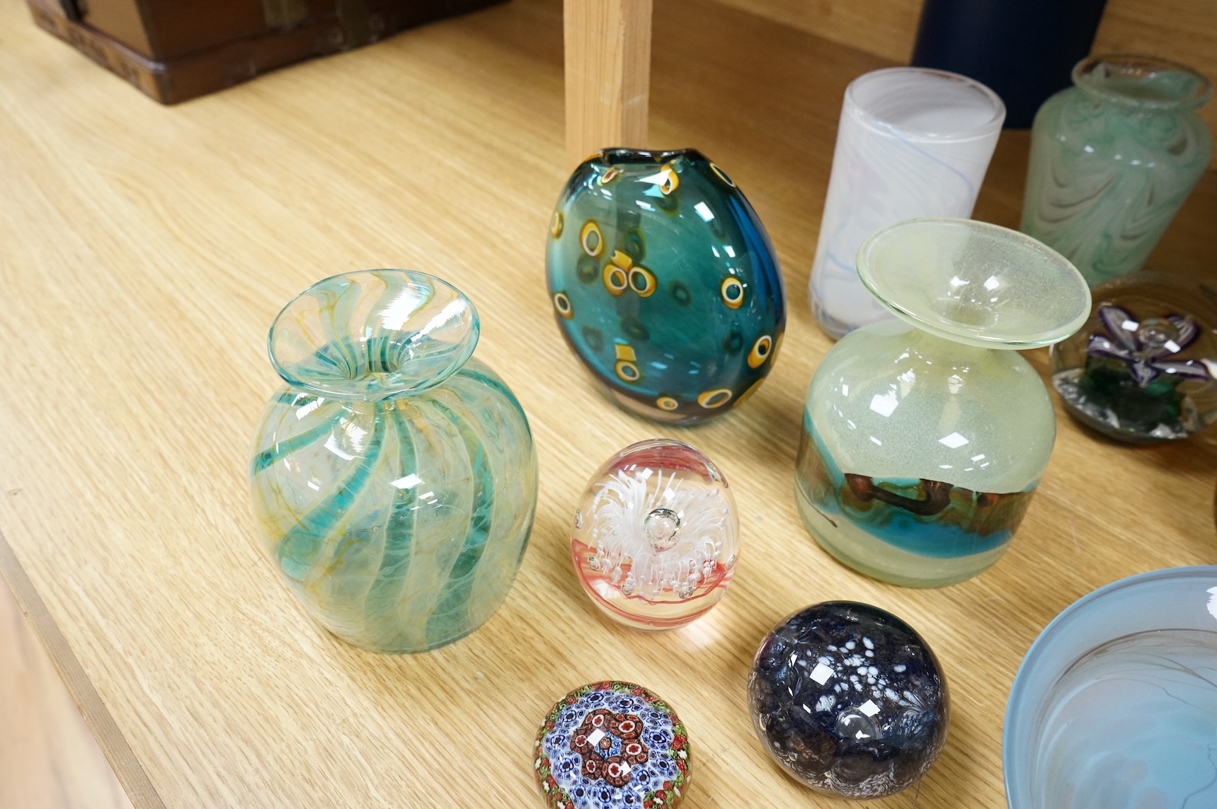 A collection of mixed art glass and paperweights, including two Mdina flared rimmed glass vases, Adrian Shankey glass, an Isle of Wight squat vase, various paperweights and a dump etc. (15)